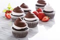 Chocolate meringue cupcakes with strawberries Royalty Free Stock Photo