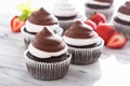 Chocolate meringue cupcakes with strawberries Royalty Free Stock Photo