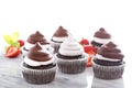 Chocolate meringue cupcakes with strawberries Royalty Free Stock Photo