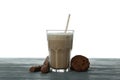 Chocolate milkshake, cookies and chocolate sticks on wooden table isolated on white background Royalty Free Stock Photo