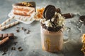 Chocolate milkshake with dripping sauce, cream, cocoa cookies Royalty Free Stock Photo