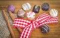Chocolate mini pralines with wired gingham ribbon in red and white color. Decorated with cinnamon sticks. Royalty Free Stock Photo