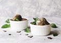 Chocolate mint ice cream in white bowls with pieces of chocolate and mint leaves on a marble table Royalty Free Stock Photo