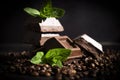 Chocolate, mint leaf, coffee beans food premium on a dark background