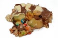 Chocolate mixture with biscuit and different types of chocolate pieces and cream with fresh pineapple ananas and bananas pieces on