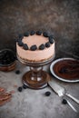 Chocolate mousse cake on a high wooden stand. Royalty Free Stock Photo