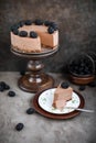 Chocolate mousse cake on a high wooden stand. Royalty Free Stock Photo