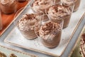 Chocolate mousse dessert with cocoa in glass on holiday background. Delicious dessert and candy bar Royalty Free Stock Photo