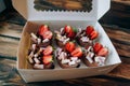 Chocolate mousse topped with sliced strawberries, peanuts in chocolate and marshmallows. Take away food. Dessert. Royalty Free Stock Photo