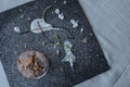 Chocolate muffin on a black board indicated by yogurt, lemon zest and icing sugar