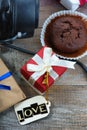 Chocolate muffin, gift boxes and label with word Love Royalty Free Stock Photo