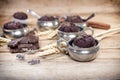 Chocolate muffin in rustic silver cup, chocolate muffin for enjoyment on wooden table