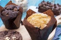 Chocolate Muffin and Vanilla Muffin with Brownie and Chocolate Cookie, Homemade Bakery on Blue Background. Sweets and Desserts on