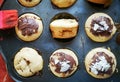 Chocolate muffins on a baking tray