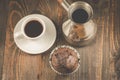 chocolate muffins, coffee cup and turks/chocolate muffins, coffee cup and turks on a wooden dark table, top view Royalty Free Stock Photo