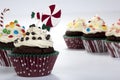 Chocolate muffins with cream and toppings Royalty Free Stock Photo