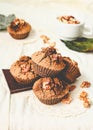 chocolate muffins with pieces of dark chocolate and walnut,tinting