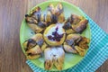 Chocolate nugget puff pastry flower with the vanilla sauce and sour cherry covered with powdered sugar