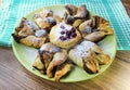 Chocolate nugget puff pastry flower with the vanilla sauce and sour cherry covered with powdered sugar