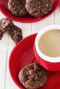 Chocolate oats cookies with chocolate-nuts spread and cup of coffee.