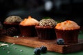 Chocolate and orange cupcakes on a wooden board with Christmas decorations. Sweet muffins Royalty Free Stock Photo