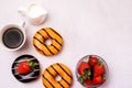 Chocolate and Orange Donuts with Fresh Strawberries and Cup of Coffee Cream Top View Flat Lay Copy Space Breakfast Concept Morning Royalty Free Stock Photo