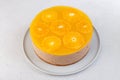 Chocolate-orange mousse cake with biscuit base, jelly and orange circles. Whole homemade cheesecake. Traditional holiday dessert. Royalty Free Stock Photo