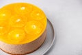 Chocolate-orange mousse cake with biscuit base, jelly and orange circles. Whole homemade cheesecake. Traditional holiday dessert. Royalty Free Stock Photo
