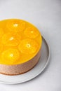 Chocolate-orange mousse cake with biscuit base, jelly and orange circles. Whole homemade cheesecake. Traditional holiday dessert. Royalty Free Stock Photo
