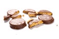 Chocolate outer biscuits with broken sections on white