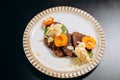 Chocolate pancakes with apricots and almond shavings