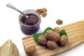Chocolate paste in glass jar, walnuts and firewood Royalty Free Stock Photo