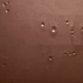 Chocolate photo background.Smooth texture of milk chocolate.