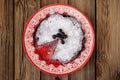 Chocolate pie with blueberry and icing sugar cut in red plate Royalty Free Stock Photo