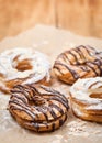 Chocolate and powdered sugar cream puff rings choux pastry