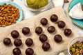 Chocolate pralines balls and other ingredients for making paleo candies. Royalty Free Stock Photo