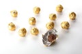Chocolate pralines wrapped in golden foil Royalty Free Stock Photo