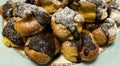 Chocolate Profiterole on a colored dish, selective focus.