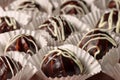 Chocolate profiterole with cream on wooden table