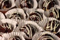 Chocolate profiterole with cream on wooden table