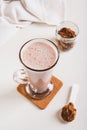 Chocolate protein energy shake drink in a glass on the table vertical view Royalty Free Stock Photo
