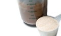 Chocolate protein shake with a scoop of protein powder isolated