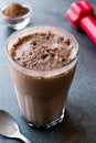 Chocolate Protein Shake Smoothie with Whey Protein Powder and Red Dumbbells Royalty Free Stock Photo