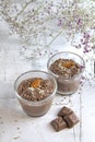 Chocolate pudding with almonds on a light background