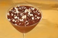 Chocolate pudding with chocolate curls in a martini glass