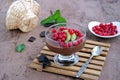 Chocolate pudding with red currants and kiwi in a glass ice-cream bowl Royalty Free Stock Photo