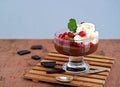 Chocolate pudding with red currants and kiwi in a glass ice-cream bowl Royalty Free Stock Photo