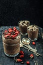 Chocolate pudding with strawberries and a clear glass