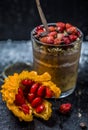 Chocolate pudding with strawberries and a clear glass