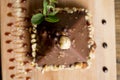 Chocolate pyramid shape cake with nuts